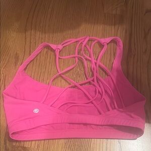 Pink Sports Bra with Strappy Back Design and Stretchy Material